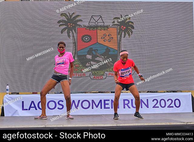 Lagos, Nigeria, 22nd November 2020. Runners dance on a stage after finishing the race at the Lagos Women Run, a 10km marathon race in Lagos