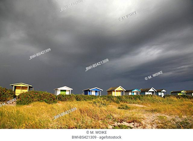 beach huts in Skanoer at approaching severe weather, Sweden, Skanoer Falsterbo