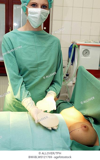 woman at operation theatre getting an breast enlargement, plastic surgery