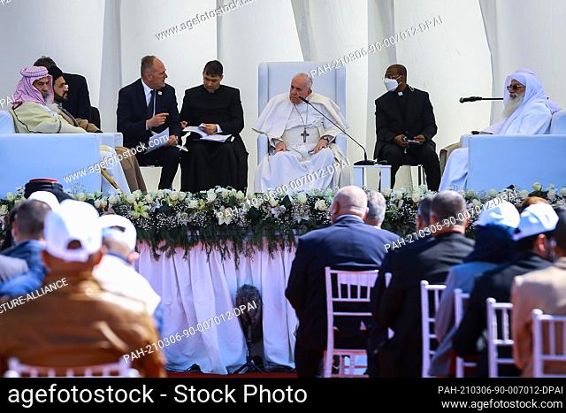 06 March 2021, Iraq, Nasiriyah: Pope Francis (C) attends an interreligious meeting in the Sumerian city-state Ur, which is mentioned in the Bible as the home of...