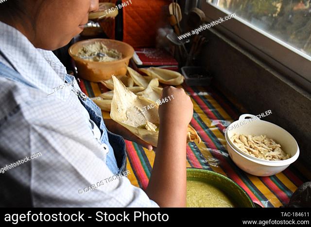 TEPOZTLAN, MEXICO - JANUARY 16: Isabel's daughter prepares 'Tamales' traditional Mexican food who are cooked in this season to celebrate the candlemas day