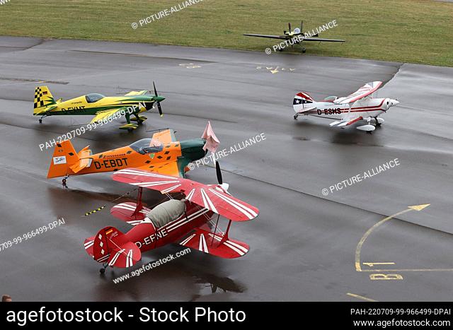 09 July 2022, Thuringia, Gera: Special aircraft for aerobatics are on the apron at the German Aerobatic Championships. According to the organizer