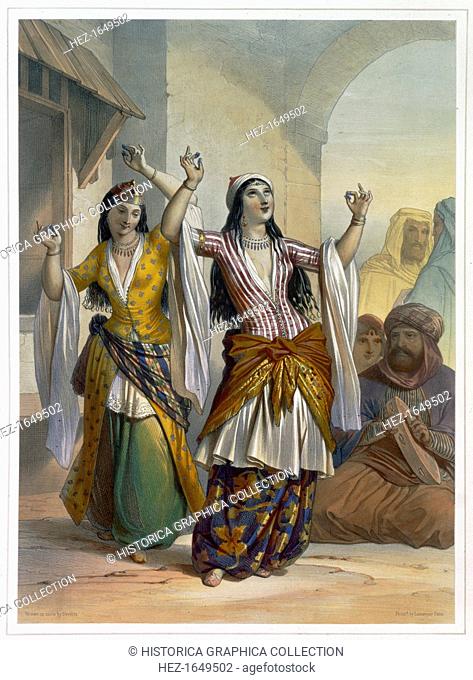 Egyptian dancing girls performing the Ghawazi at Rosetta, Egypt, 1848. Illustration from The Valley of the Nile by Emile Prisse d'Avennes