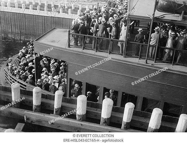 Commuters on a ferry entering a 'slip', 1915-20. Commuters used ferries from New Jersey, Brooklyn and Staten Island to travel to Manhattan (BSLOC-2016-10-181)