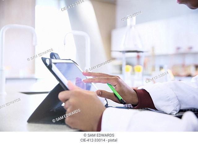Scientist using digital tablet in laboratory
