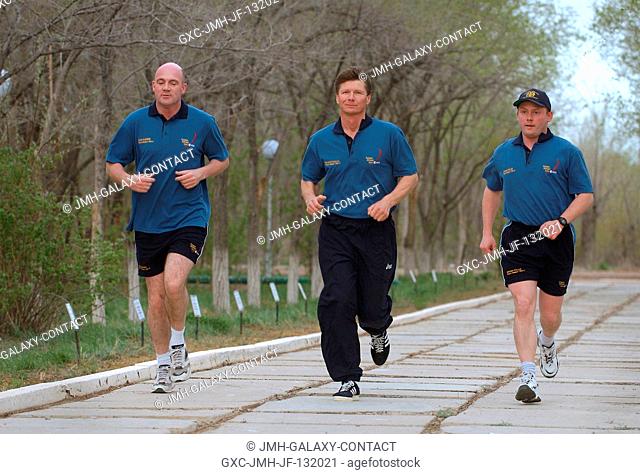 European Space Agency (ESA) astronaut Andre Kuipers (left) of the Netherlands; cosmonaut Gennady I. Padalka (center), Russia's Federal Space Agency Expedition 9...