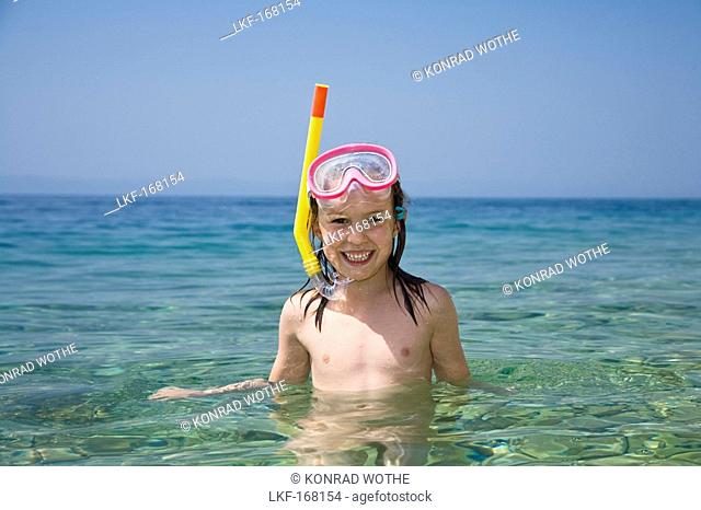 Little girl with diving mask and snorkel, snorkeling in the sea, Croatia, Europe