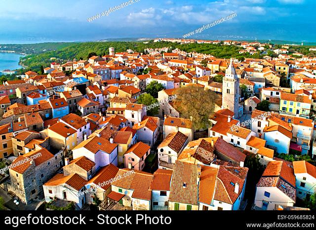 Town of Omisalj on Krk island old church and rooftops aerial view, Kvarner bay of Croatia