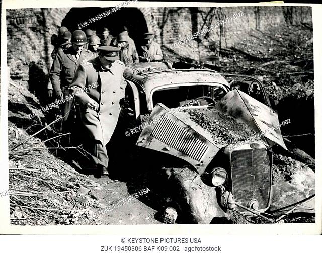Mar. 06, 1945 - Mr. Churchill in Germany visit to famous Citadel in Julich: Photo shows Mr. Churchill passes a damaged German car in the famous Citadel in...
