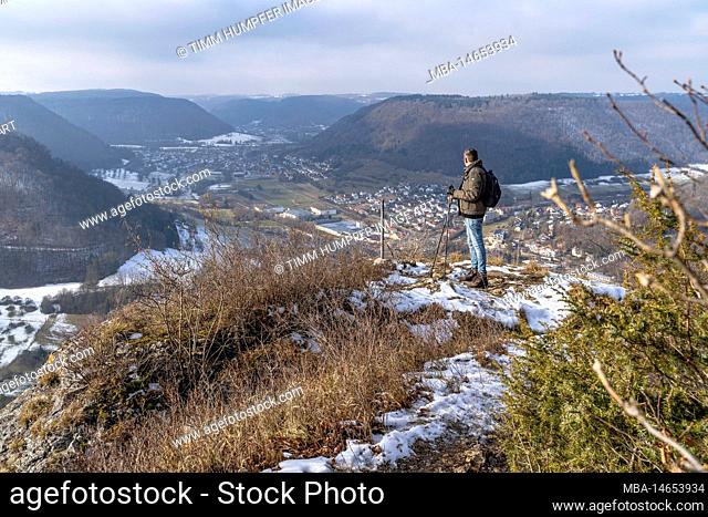Europe, Germany, Southern Germany, Baden-Wuerttemberg, Swabian Alb, Filstal, Bad Ditzenbach, hiker at viewpoint Oberbergfels