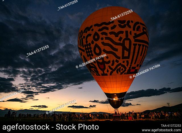 ARMENIA, STEPANAVAN - AUGUST 26, 2023: Participants ride a hot air balloon during the Air Fest IV Stepanavan featuring planes, helicopters, skyballs