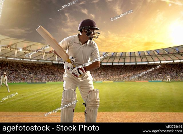 Cricketer, batsman ready to face the ball on the stadium