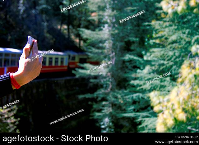 Railway in the Himalayas. The train goes among the mountains and tunnels