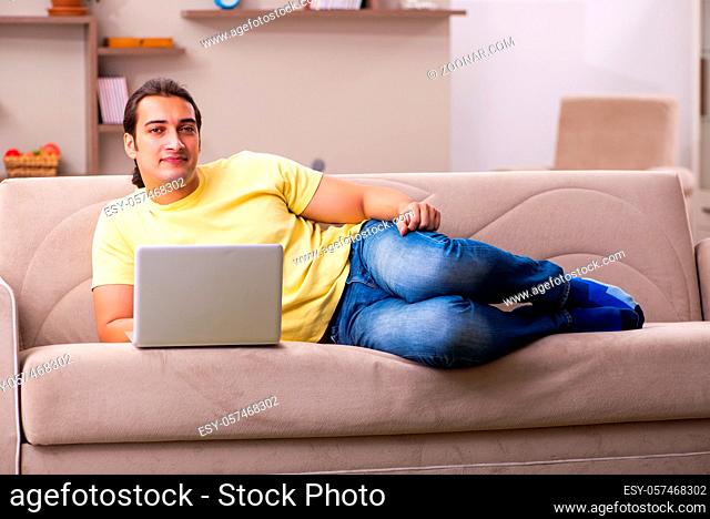 Young male freelancer in teleworking concept