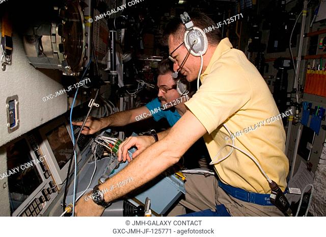 European Space Agency astronaut Paolo Nespoli (foreground) and Russian cosmonaut Alexander Kaleri, both Expedition 26 flight engineers
