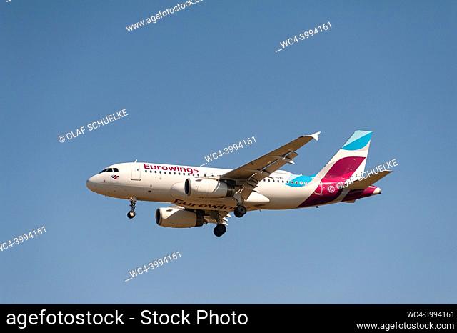 Berlin, Germany, Europe - A Eurowings Airbus A319-100 passenger aircraft with the registration D-AGWO approaches Berlin Brandenburg Airport BER for landing