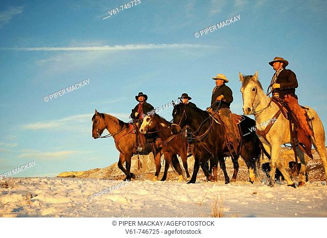 Wranglers out for a ride in the snow, Shell, Wyoming, USA