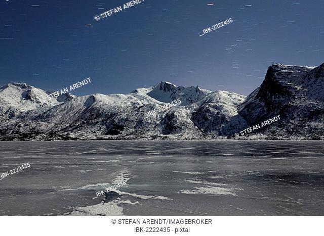 Frozen lake and mountain at night on the Lofoten Islands, Norway, Europe, PublicGround