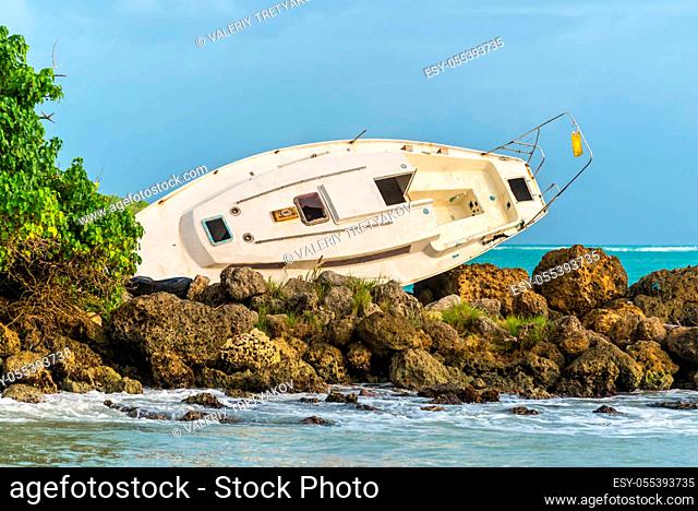 Sailboat was destroyed and abandoned on the shore after a hurricane - the Gosier in Guadeloupe, Caribbean