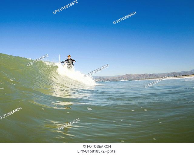 A male surfing