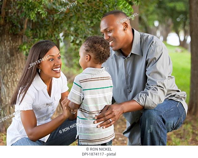 fort lauderdale, florida, united states of america, a mother and father with their young son