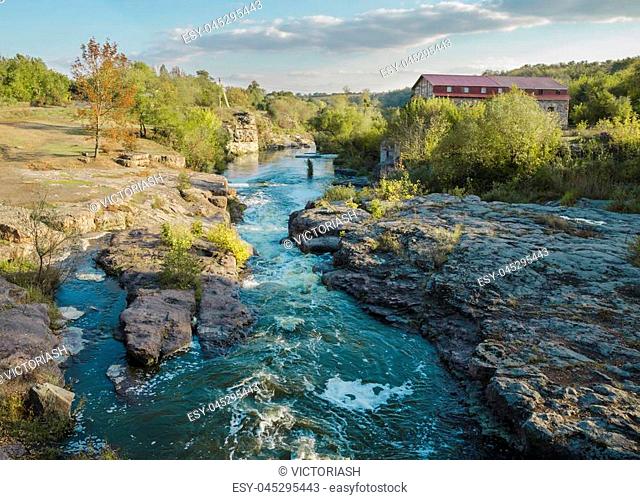 day in the afternoon, flowing river Gorny Tikich among stones, and a canyon in the village of Buki, Ukraine
