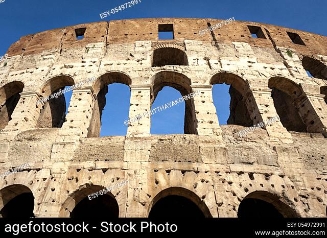 Architectural details of the facade of the Colosseum (Coliseum) or Flavian Amphitheatre, the largest Roman amphitheater located in city of Rome, Italy