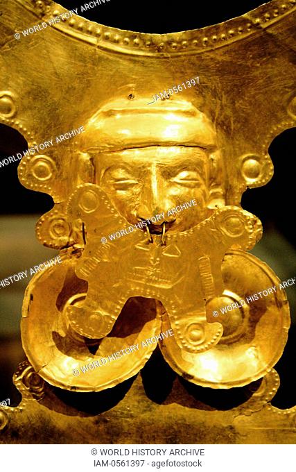 Pectoral Ornament. Colombia Yotoco (Calima) 1st - 7th century. Hammered gold. The human face in the centre of such pectorals was created by hammering the metal...