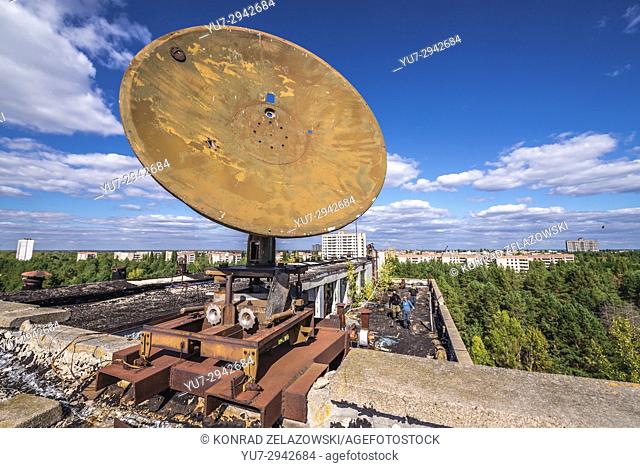 Satellite dish on the roof of abandoned Jupiter Factory in Pripyat ghost town of Chernobyl Nuclear Power Plant Zone of Alienation in Ukraine