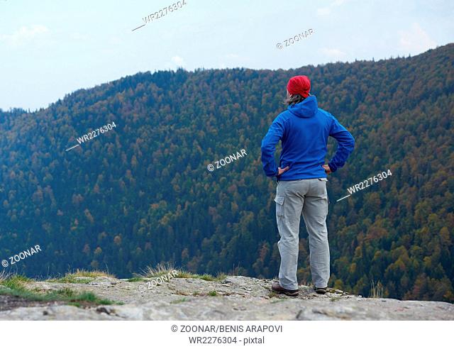 advanture man with backpack hiking