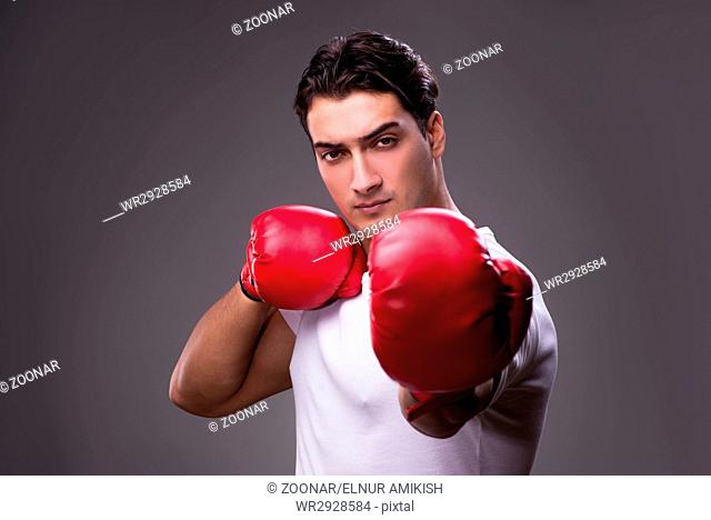 Handsome boxer in boxing concept