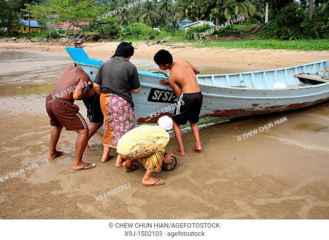 Fishermen with a boat, Teluk Melano, Sarawak, Borneo