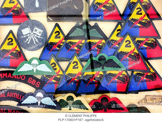 Assortment of military insignias for sale at militaria fair
