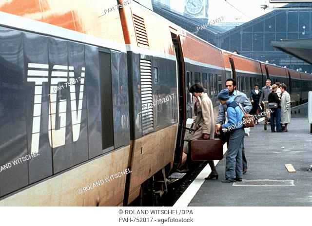 Travelers board the modern TGV express train at Gare de Lyon in Paris in 1981. Since September 1981, on a new line between Paris and Lyon