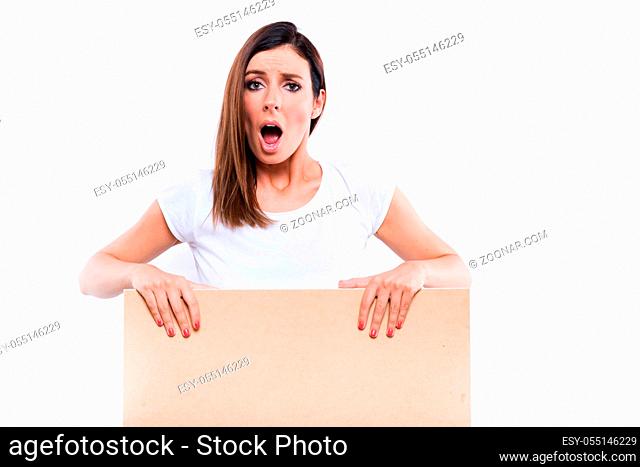 A beautiful young woman standing with a wooden box signboard and feeling worried