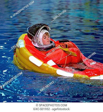 Astronaut Julie Payette deploys a life raft during emergency bailout training. The STS-96 mission specialist, who represents the Canadian Space Agency CSA