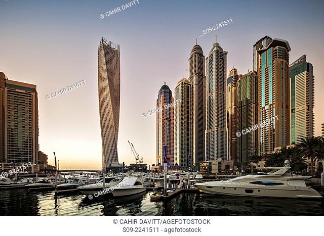 Dubai Marina at sunset with the Cayan Tower (Infinity Tower), the Dubai Marriott Harbour Hotel and Suites and various residential towers, Dubai Marina, Dubai