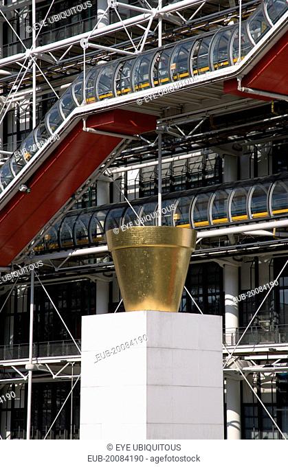 The gilded sculpture Le Pot Dore by Jean-Pierre Raynaud in the Place Georges Pompidou in front of the Pompidou Centre in Beauborg Les Halles