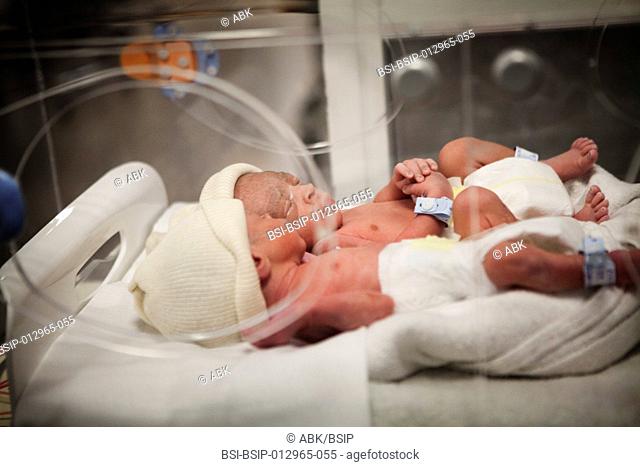 Photo essay at the maternity of Saint Maurice hospital in France. Birth of premature twins. The twins placed in incubator are taken to the labor ward before...