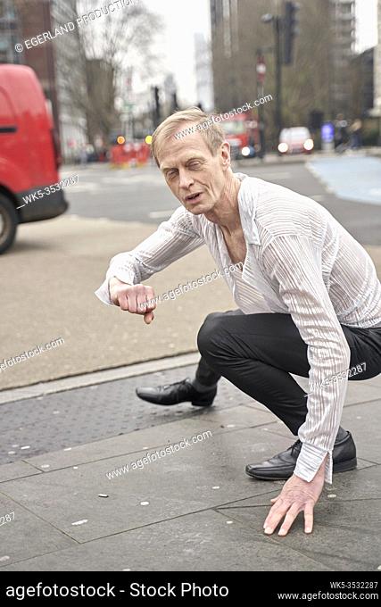 assertive man feeling inner world at street in London, England, Great Britain