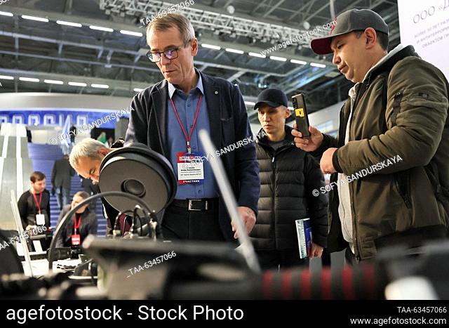 RUSSIA, MOSCOW - OCTOBER 17, 2023: Men approach an NR-900EMS profession non-linear junction detector on display during the Interpolitex 2023 International...