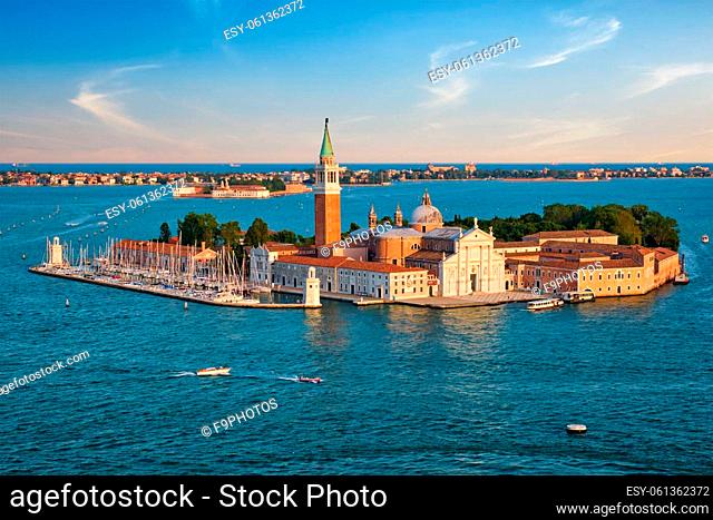 Famous Italy tourist destination - aerial view of Venice lagoon and San Giorgio di Maggiore church with boats and vaporetto traffic on sunset from St Mark's...