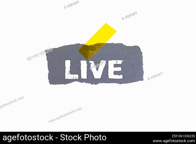 Grey torn paper with yellow adhesive tape showing: Live