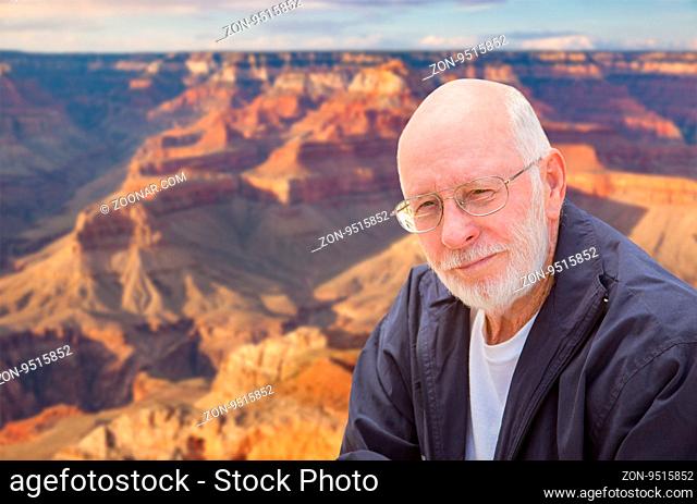 Happy Senior Man Posing on the Edge of The Grand Canyon