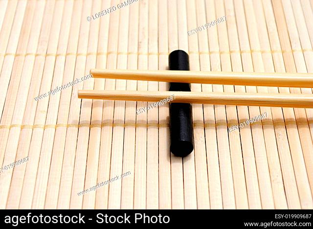 japanese chopsticks on bamboo placemat background