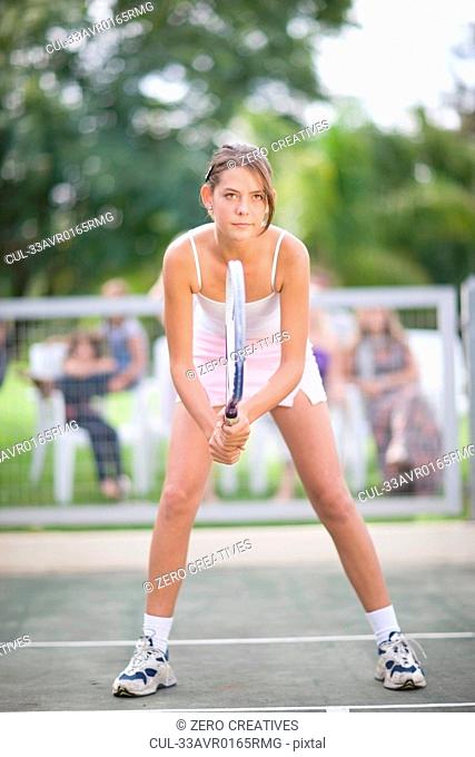 Girl poised during tennis game