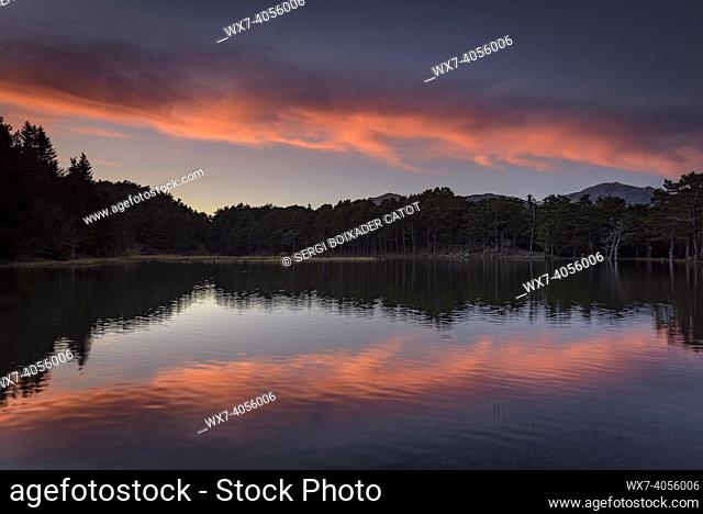 Red sunset in Bassa d'Oles lakes (Aran Valley, Catalonia, Spain, Pyrenees)