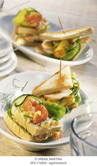 Two sandwiches with shrimp salad and chicken salad