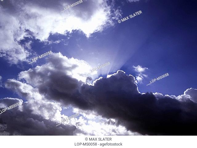 England, West Midlands, Birmingham, Sunlight behind clouds after storm