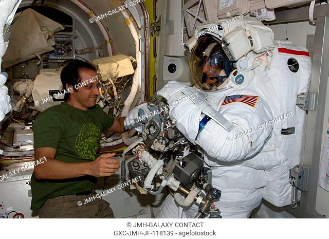 NASA astronauts Joe Acaba and Sunita Williams, both Expedition 32 flight engineers, prepare for the start of the mission's second session of extravehicular...